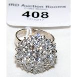 A good quality diamond cluster ring in 18ct gold setting
