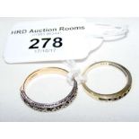 A 9ct gold diamond half hoop eternity ring and a smaller similar ring