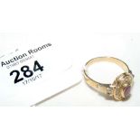 The matching 18ct gold ruby and diamond ring
