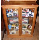 A two door pine display cabinet