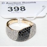 A black and white diamond ring in 9ct gold setting