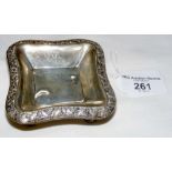 A Hamilton & Co. of Calcutta silver pip dish with vine border and Lion paw feet