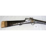 An antique Middle Eastern rifle with bone decoration to the handle