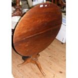 An 80cm diameter antique snap-top table