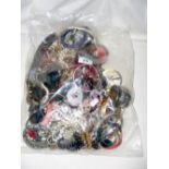 A large bag of costume jewellery, including bangles and necklaces