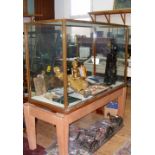 An old Edmonds Museum Fitter's cabinet on stand, having brass frame and maker's badge - the glazed