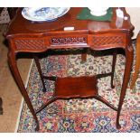 A mahogany serving table with shaped top