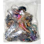 A large bag of costume jewellery, including bangles and necklaces