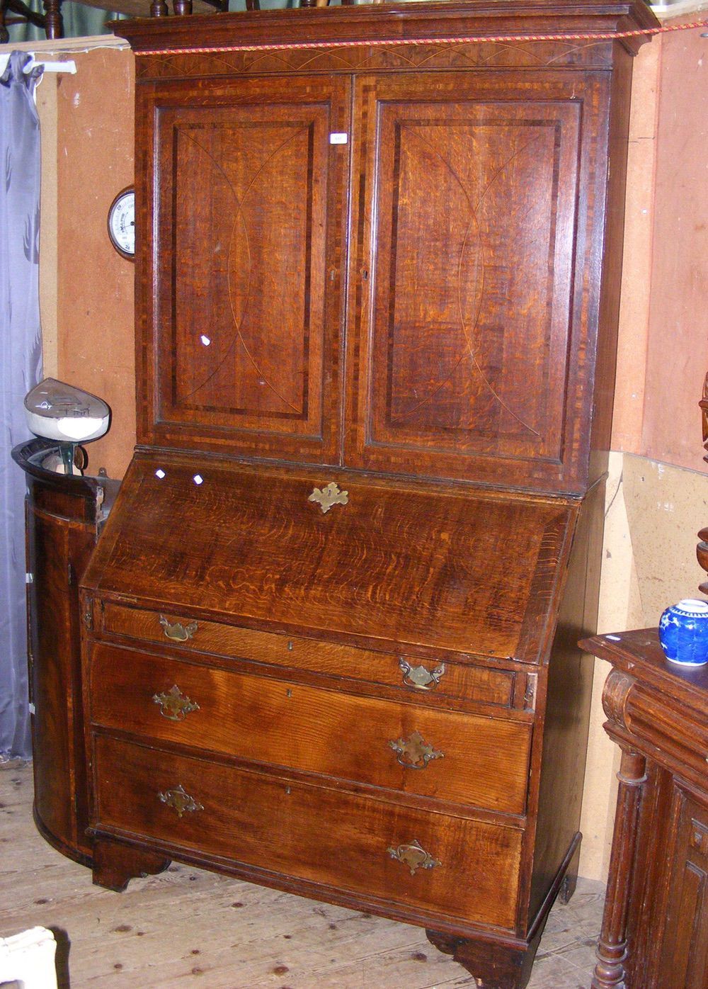 A Georgian oak bureau bookcase with cross banded top and drawer fronts - 112cm wide