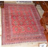 Middle Eastern carpet with red ground and geometric border - 170cm x 135cm