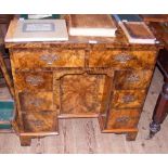 A lady's Georgian style walnut writing desk with eight drawers to the front - 80cm wide