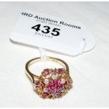 A ruby and opal cluster ring in 9ct gold setting