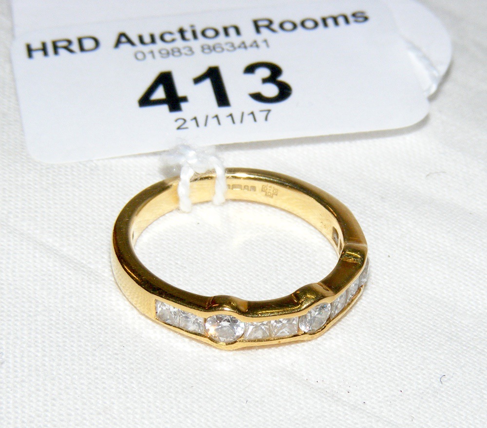 An unusual eleven stone diamond ring in 18ct gold setting