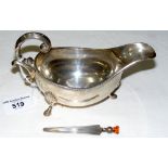 Silver gravy boat with page marker