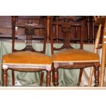 A pair of Edwardian nursing chairs with turned front supports