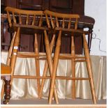 A pair of stick back bar stools