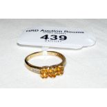 A citrine three stone ring in 9ct gold setting