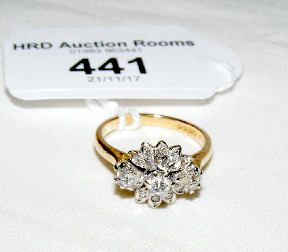 A diamond cluster ring in 18ct gold setting