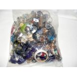 A large bag of costume jewellery, including bangles and necklaces