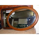Oval antique wall mirror, together with one other
