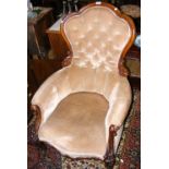 A Victorian button back easy chair with cabriole front supports
