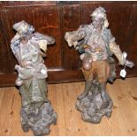 A pair of 60cm high continental figures with hand painted decoration