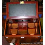An antique inlaid stationery cabinet