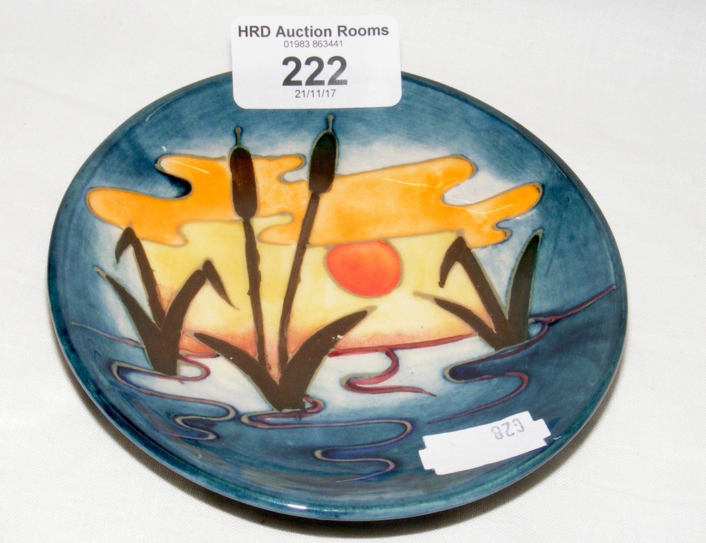 A Moorcroft pin dish with reed and sunset design - 12cm diameter - with mark to base