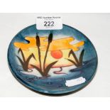 A Moorcroft pin dish with reed and sunset design - 12cm diameter - with mark to base