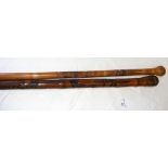 An old carved Chinese walking stick bearing signature and one other