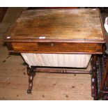 A Victorian rosewood worktable with fitted interior on lyre supports