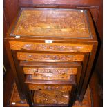 A nest of four carved oriental occasional tables