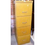 An antique four drawer filing cabinet