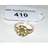 A peridot? and seed pearl ring in gold setting