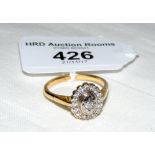 A diamond cluster ring in 18ct gold setting