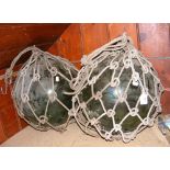 Pair of large green glass fishing floats