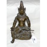 A bronze Buddhist deity holding a mongoose in his left hand - probably 18th century - with remains