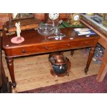 A 19th century mahogany desk with two drawers to the apron on turned supports - the left hand drawer