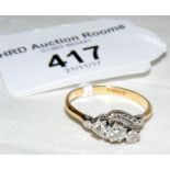 A three stone diamond ring in gold setting