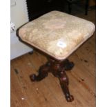 A Victorian revolving piano stool with tapestry top
