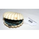 A Victorian ivory clam shaped purse