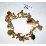 A 9ct gold charm bracelet - 59g