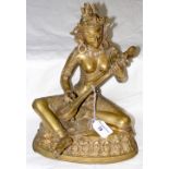 Cast metal figure of deity playing musical instrument - 32cm high