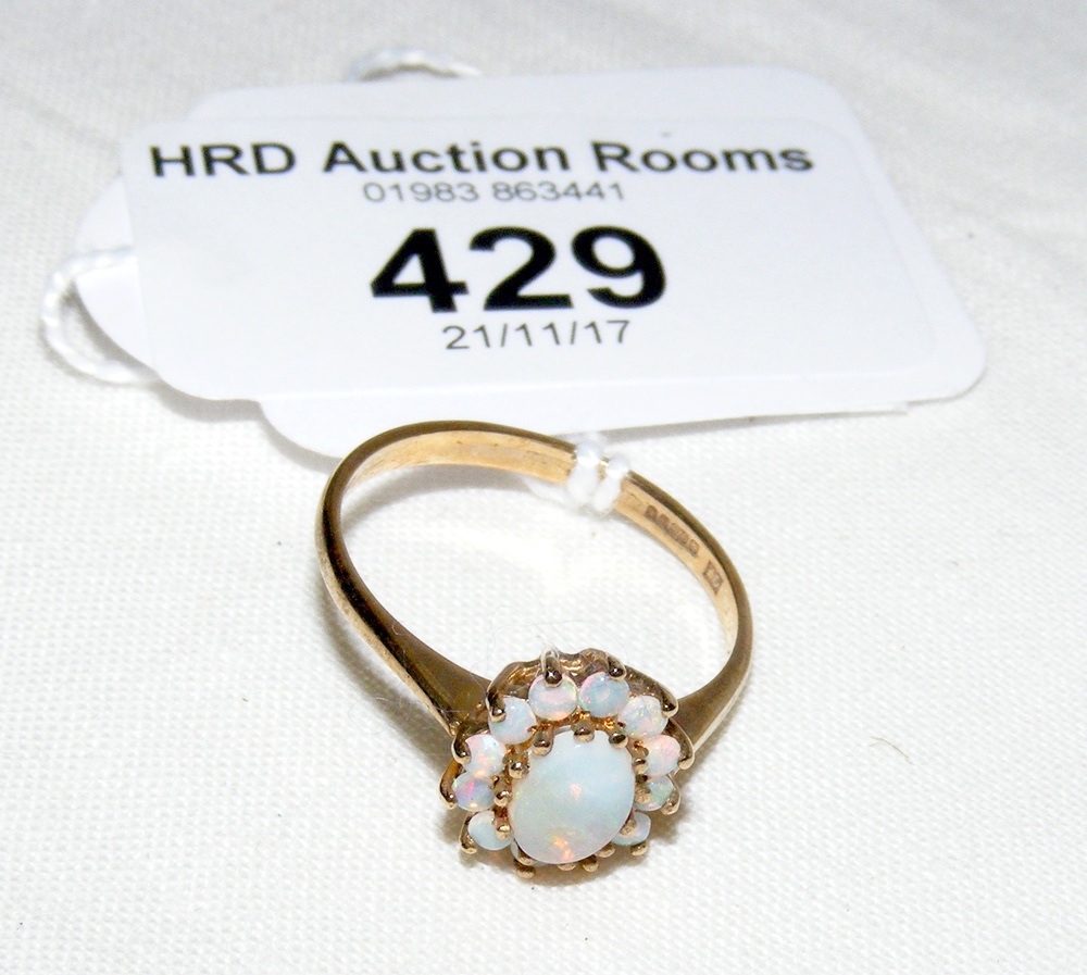 An opal cluster ring in 9ct gold setting