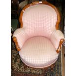 A 19th century easy chair with shaped backrest