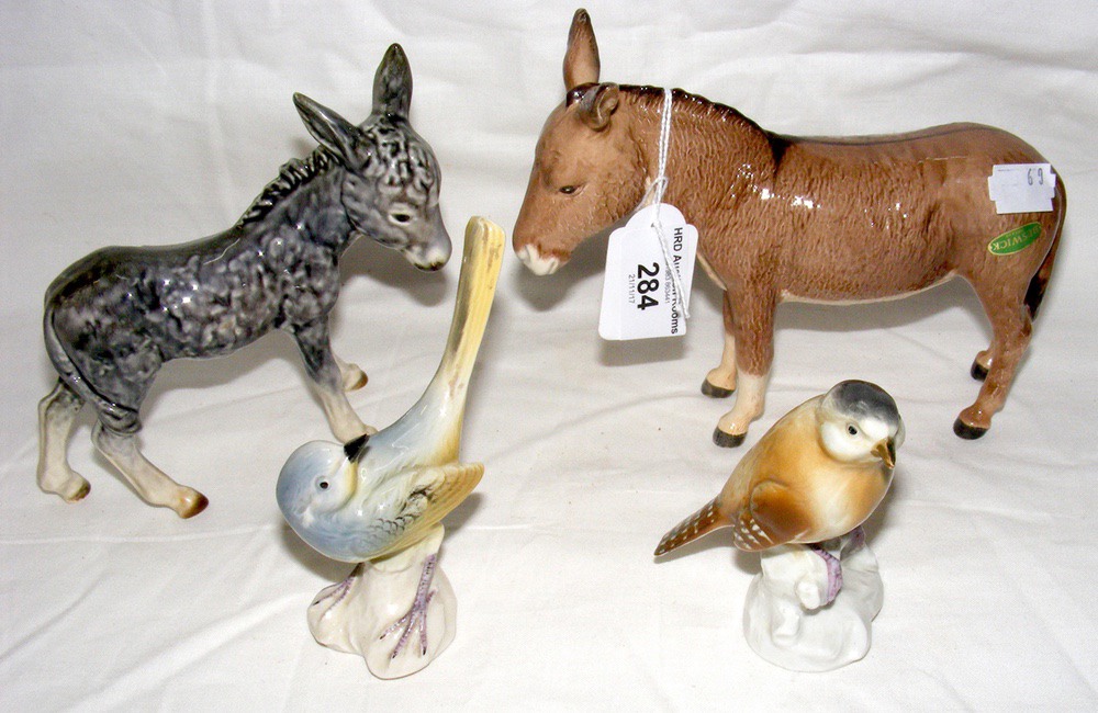 A Beswick Donkey ornament, together with birds, etc.