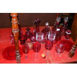 Large selection of cranberry glass, including decanters, Isle of Wight paperweight