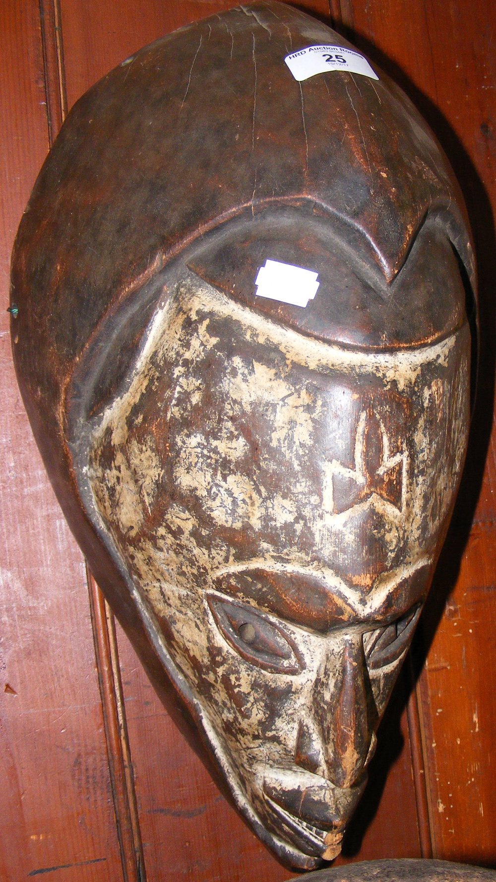 A carved wooden African tribal mask - white painted face - 44cm