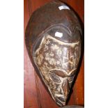 A carved wooden African tribal mask - white painted face - 44cm