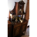 An Edwardian rosewood sideboard with inlaid ivory decoration, having glazed top and drawers and